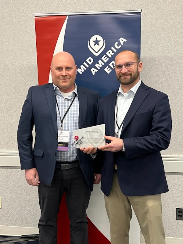 Image of Chris Schmiesing accepting award